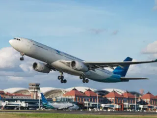 Plane Takes Off From Bali Airport.jpg