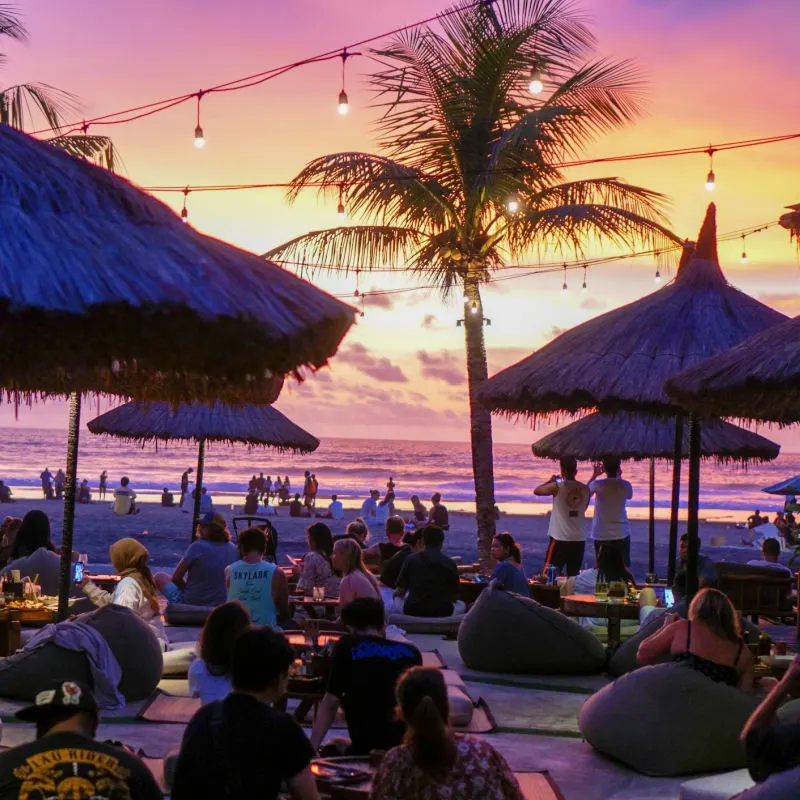 Tourists-at-Beach-Club-in-Seminyak-Bali-at-Sunset