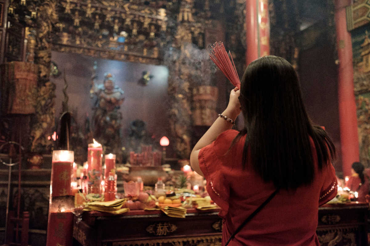 Woman Prays At Chinese Temple.jpg