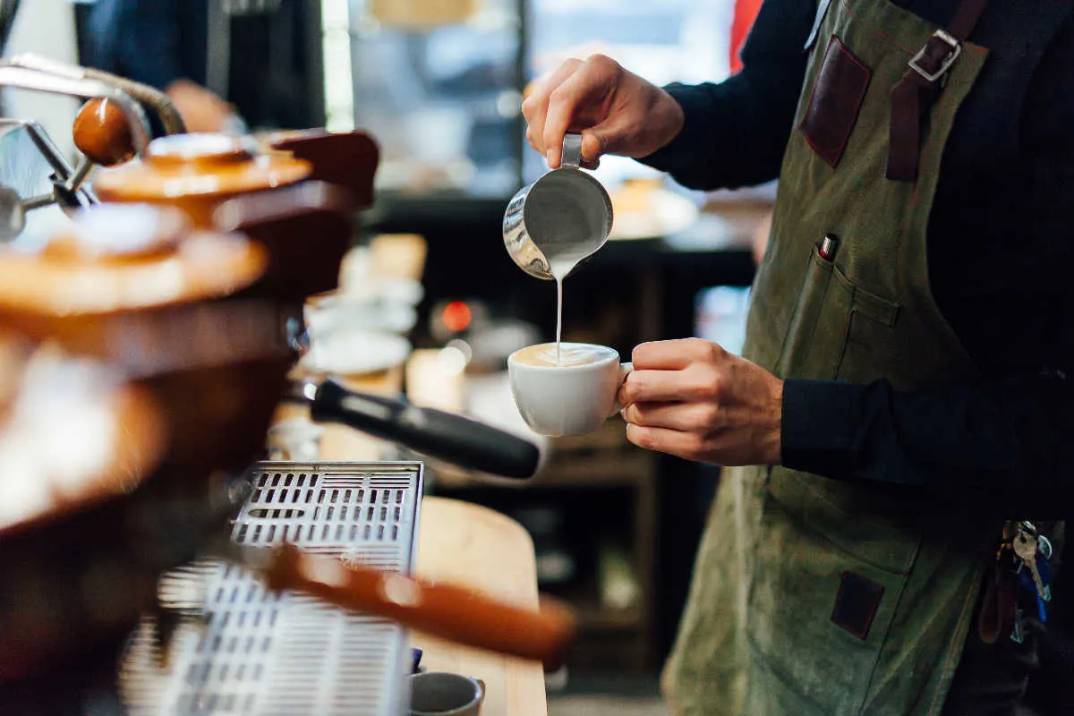 Barista pours coffee in cafe.jpg