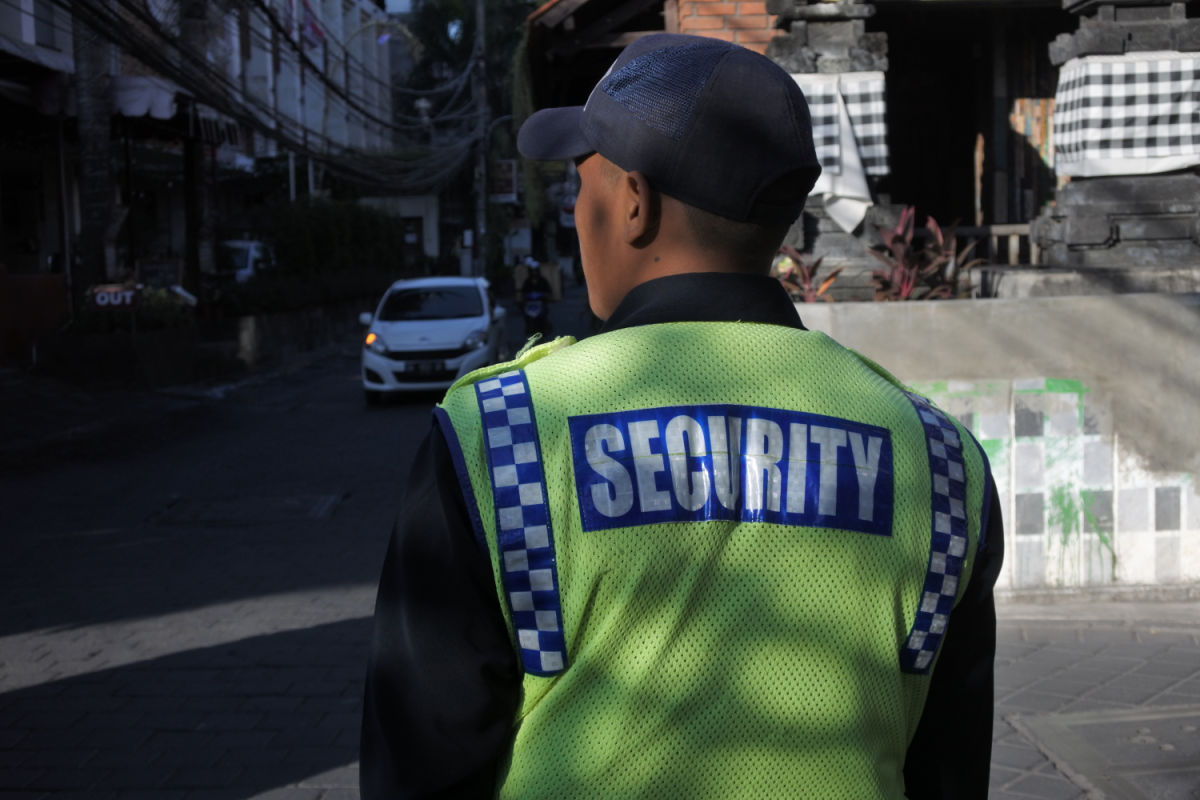 Security Officer stands on Bali street.jpg