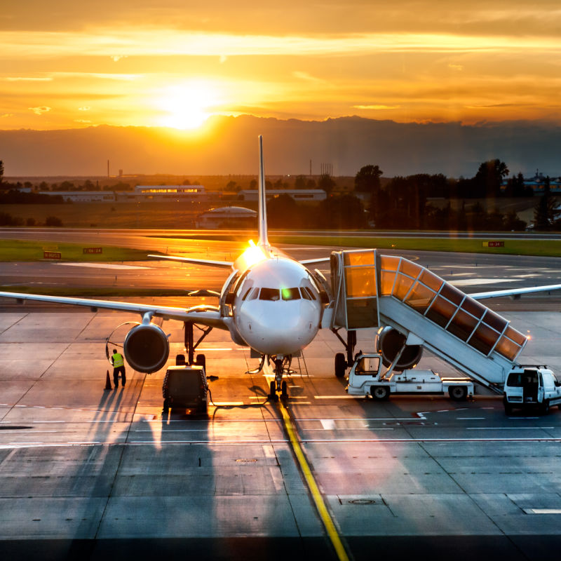 Airport Runway and Plane at Sunset.jpg
