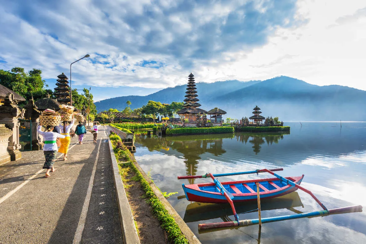 Women Walk Towards Pura Beratan In Bali.jpg