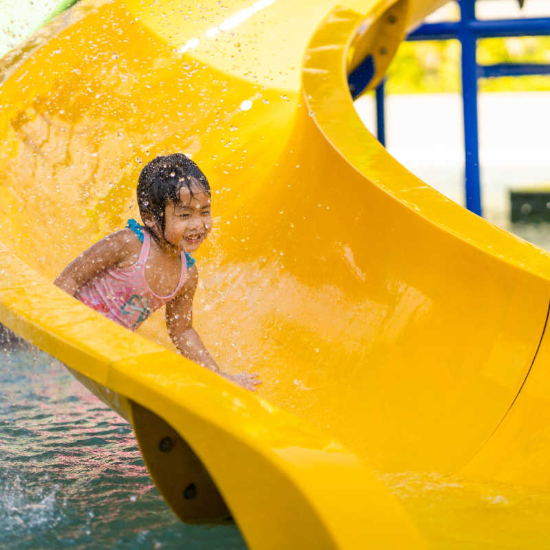 Child On Yellow Waterslide at Theme Park in Bali.jpg