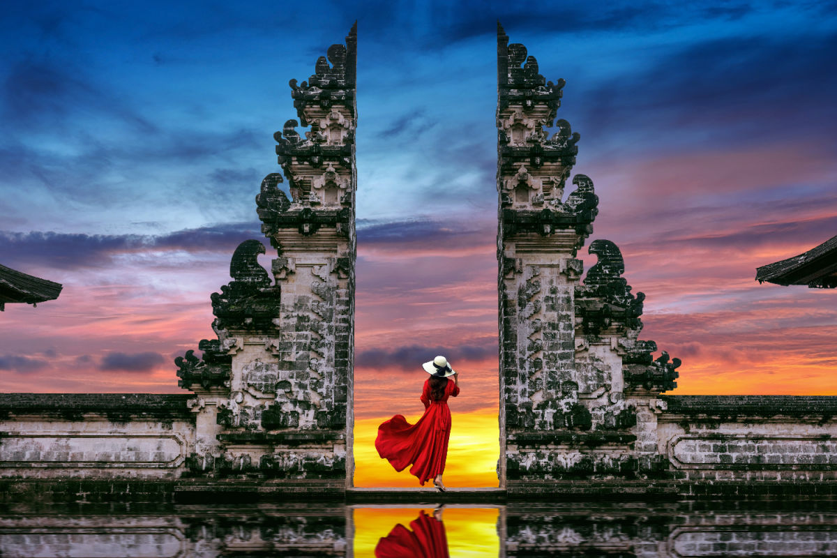 Tourist Woman Stands at Bali's Gates Of Heaven Temple.jpg
