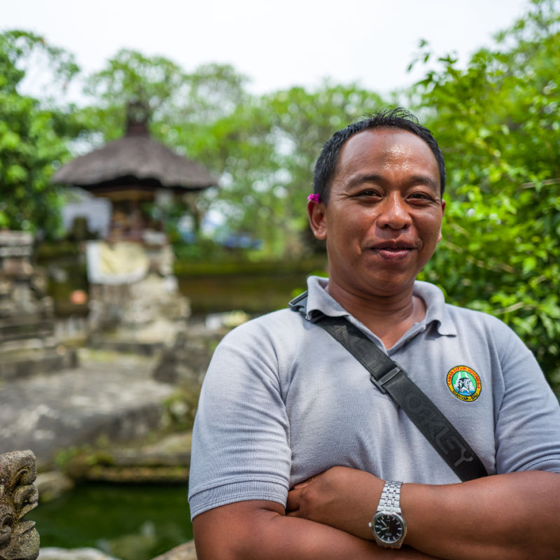 Tour-Guide-Stands-By-Bali-Temple