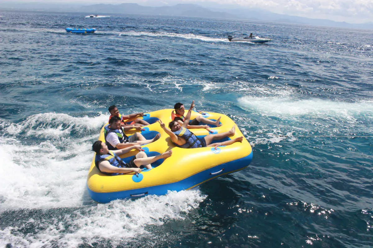 Tourists Do Watersports Tubing FlyFish in Bali.jpg