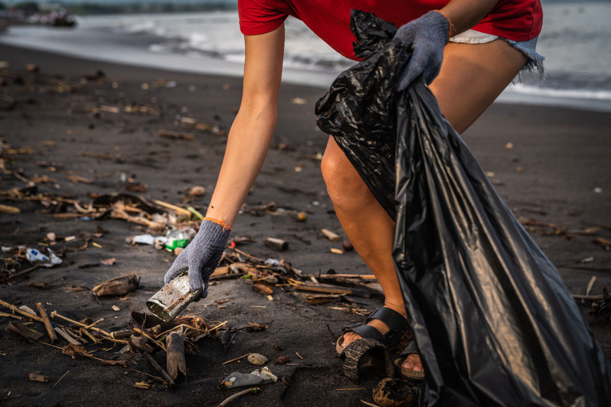 Local Person Picks Up Trash Waste on Bali Beach.jpg