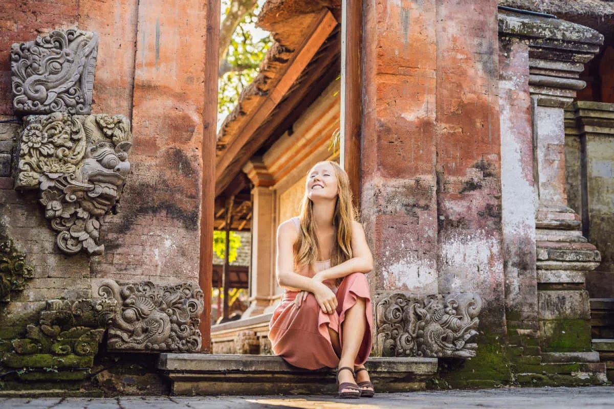 Woman Tourist Sits On Step in Ubud Bali.jpg