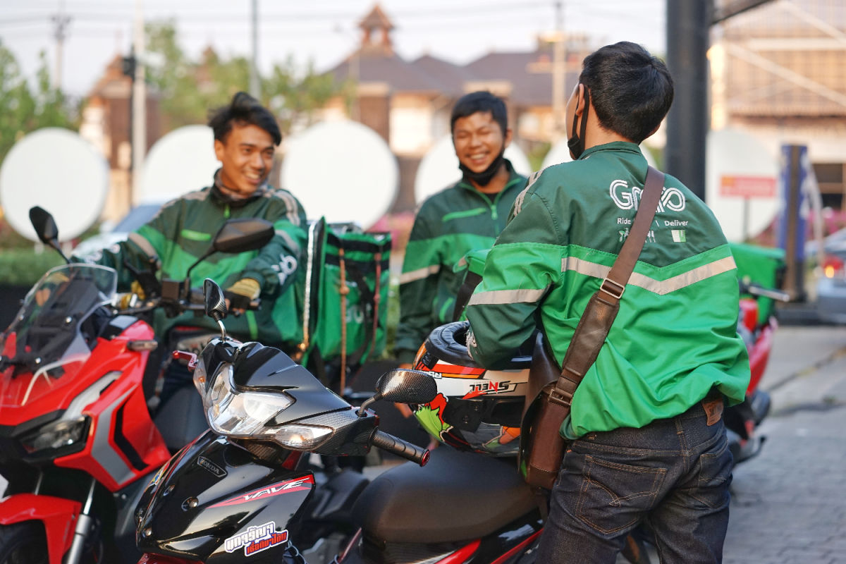 Grab drivers on motorcyles hang out taxi.jpg