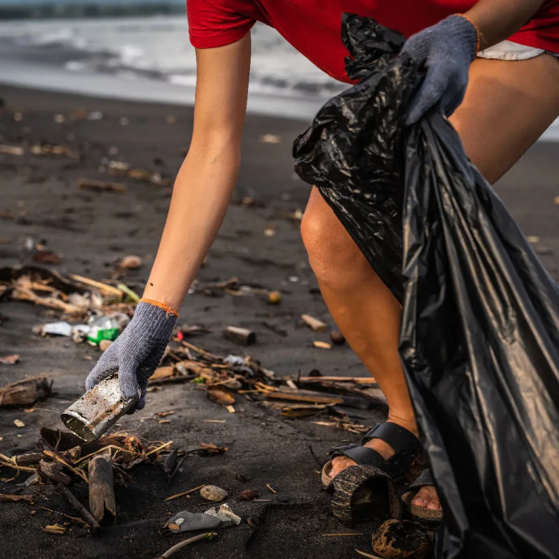 Local-Person-Picks-Up-Trash-Waste-on-Bali-Beach