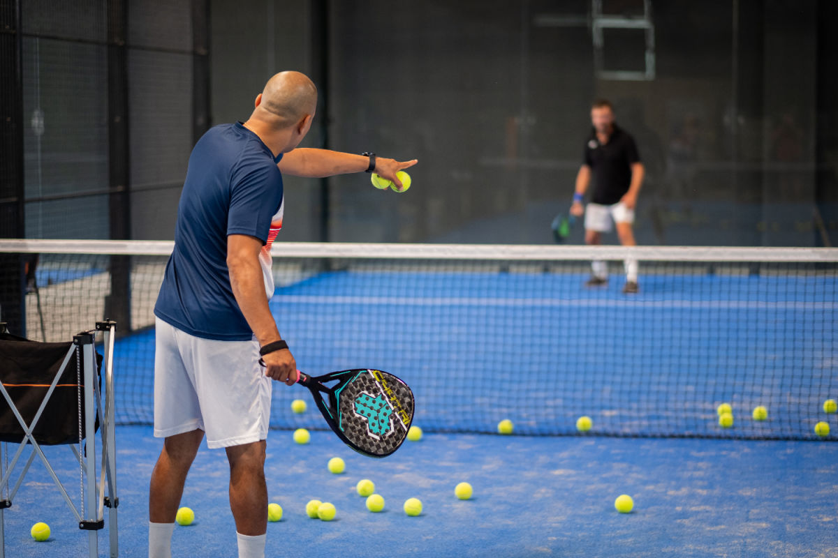 padel coach and player on court.jpg