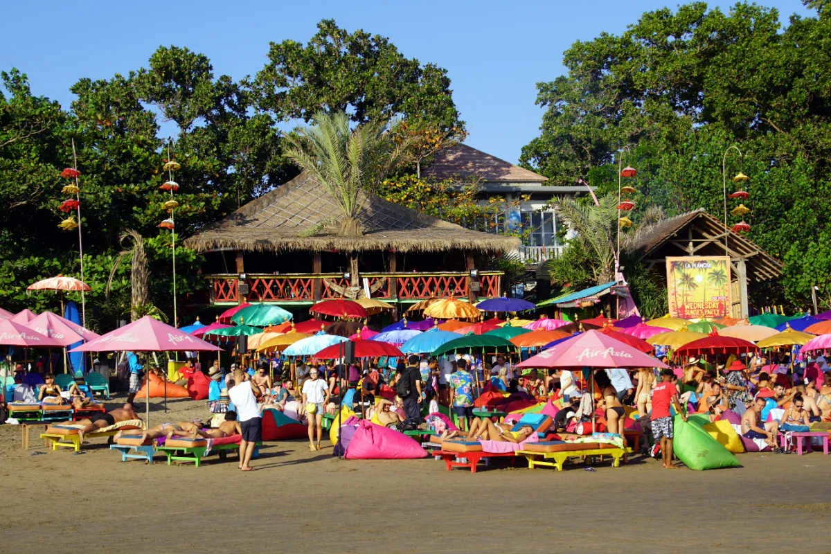 Tourists on beanbags at Seminyak Beach