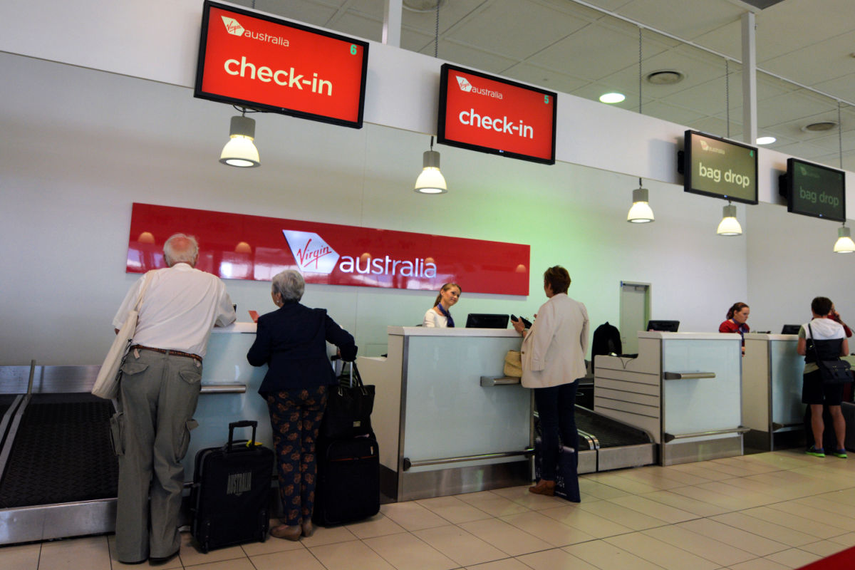 Passengers Check In At Virgin Australia Desk Airport