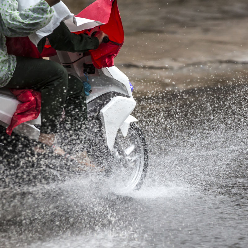 Motorcycle-Drives-in-Bad-Weather-Rain-Storm-Flood