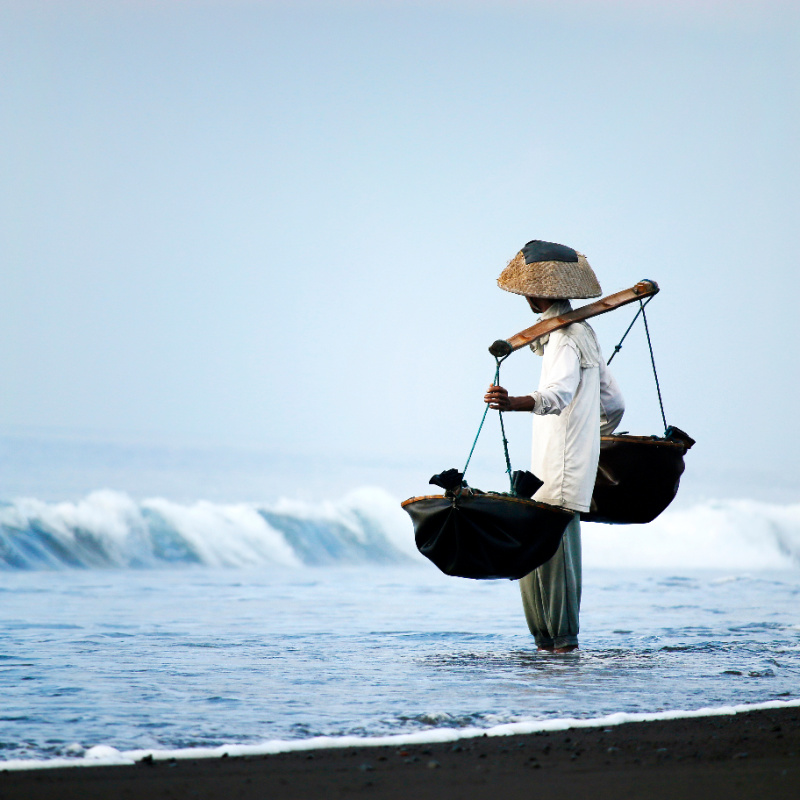 Salt-farmer-on-Bali-Black-Sand-Beach