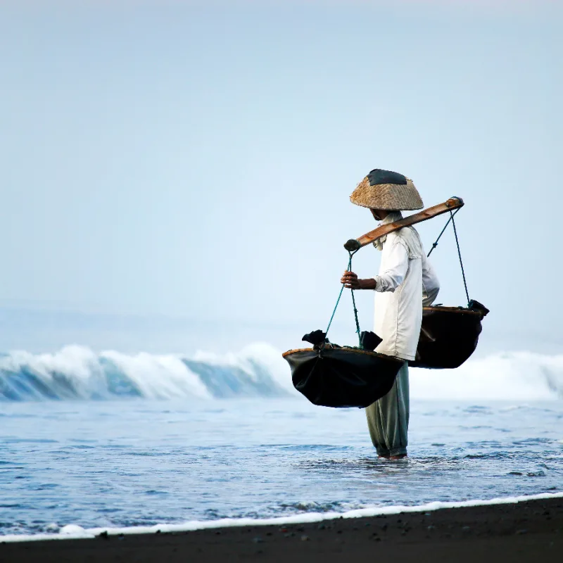 Salt-farmer-on-Bali-Black-Sand-Beach
