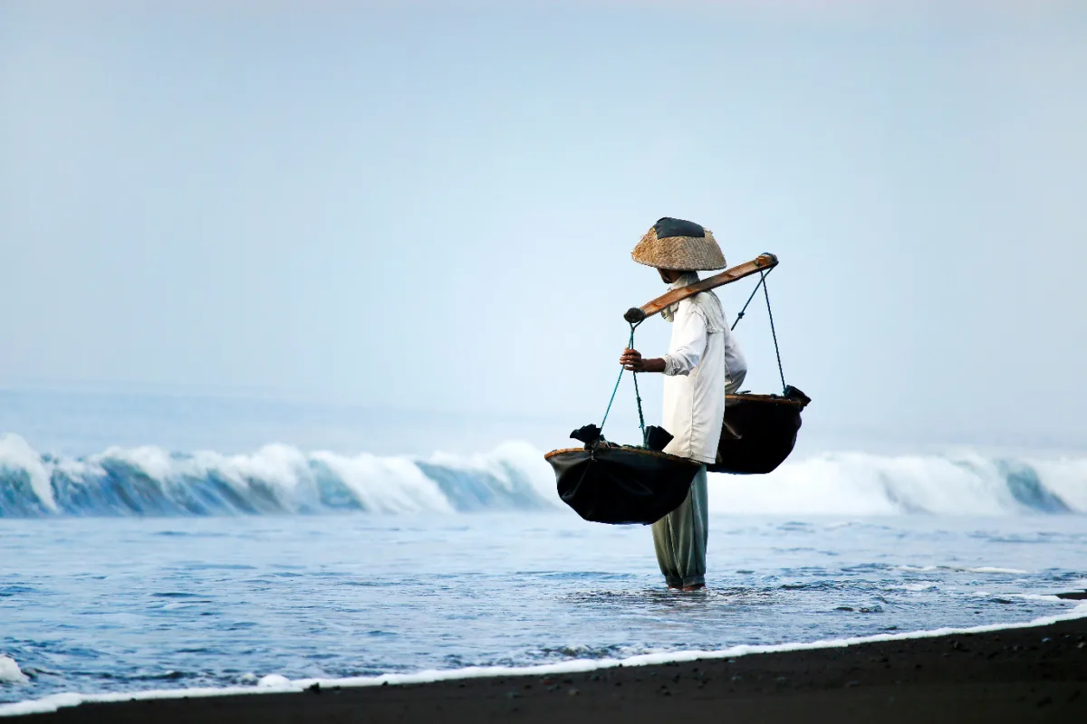 Salt farmer on Bali Black Sand Beach.jpg