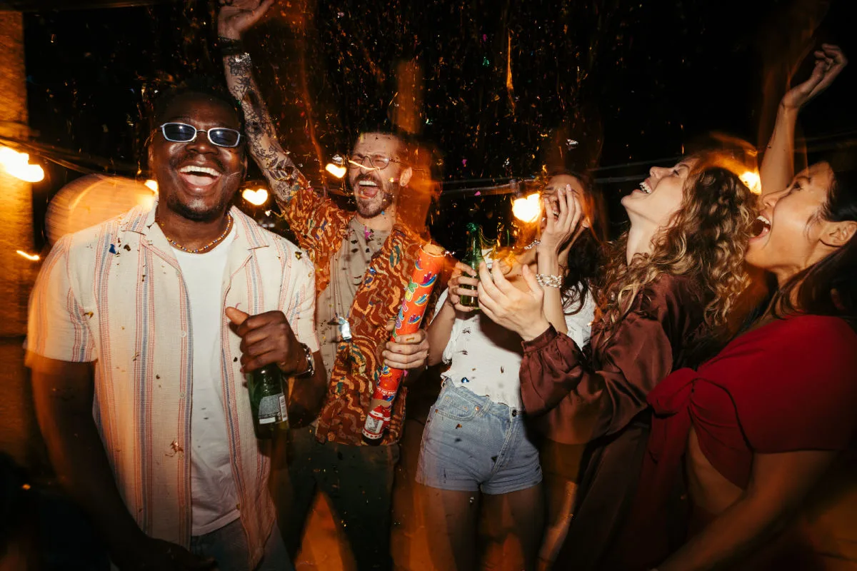 People hold drinks at party nightclub festival live music event.jpg