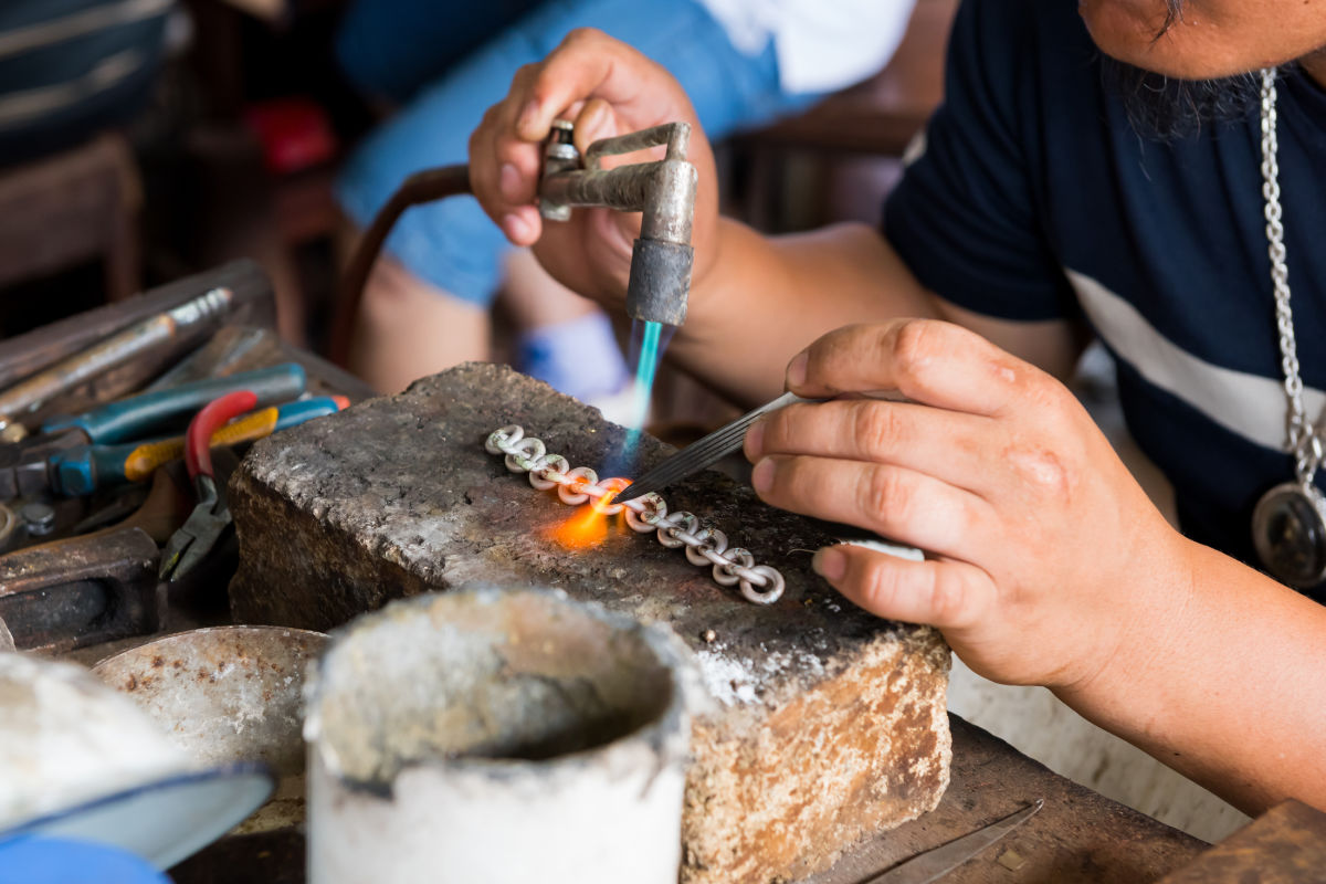 Silversmith working on silver.jpg