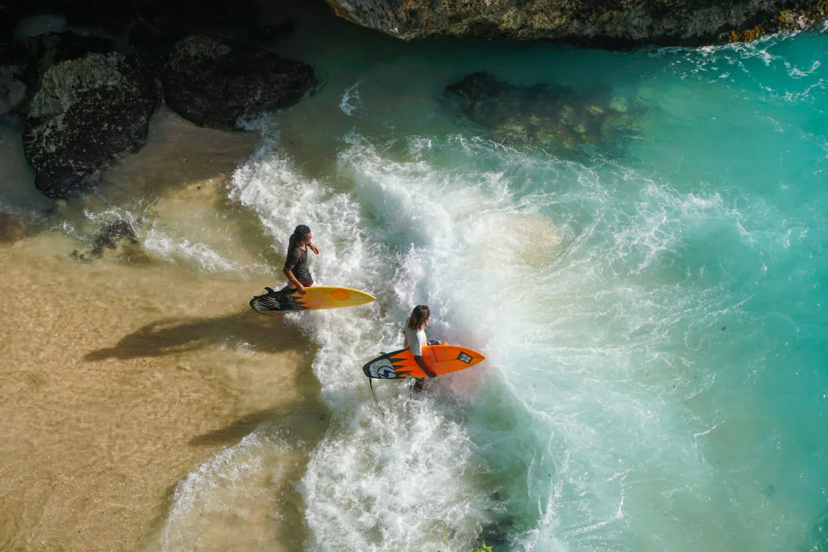 Surfers Enter Bali Ocean.jpg