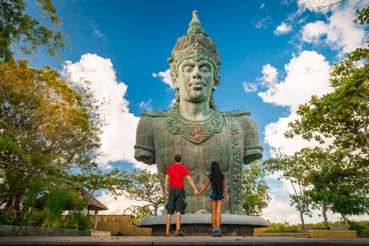 Tourists Stand in Front fo GWK Cultural Statue in Bali