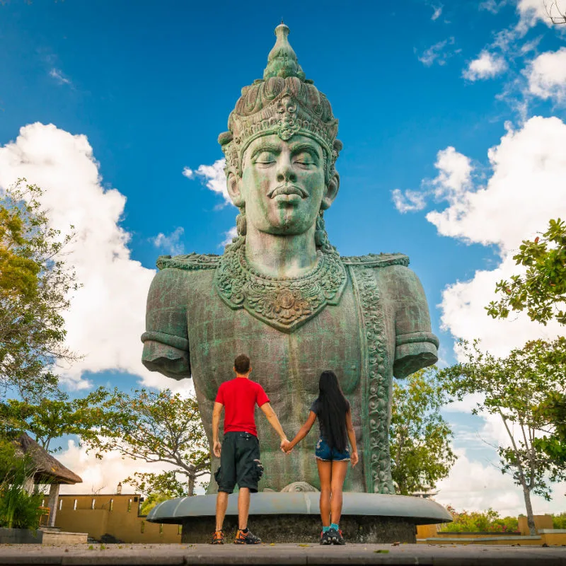 Tourists-Stand-in-Front-fo-GWK-Cultural-Statue-in-Bali