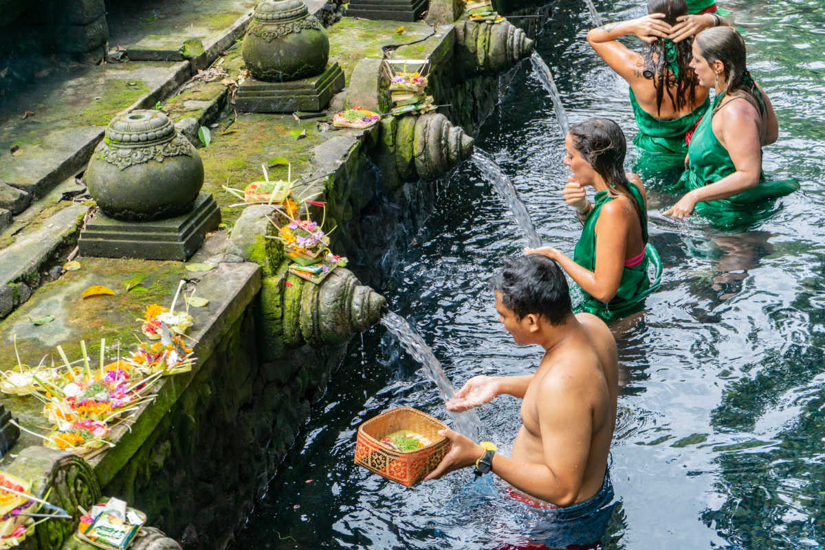 Tourists Do Melukat At Tirta Empul Temple in Bali.jpg