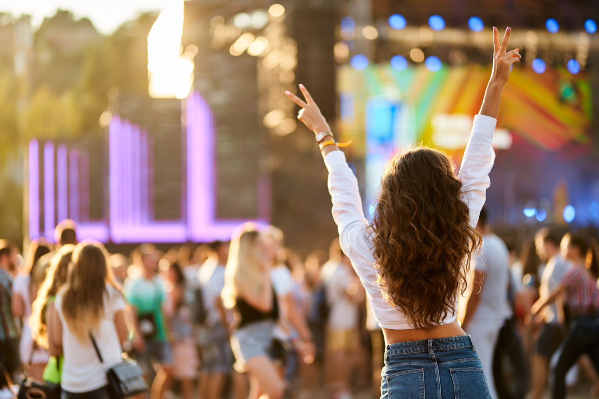 Woman Looking At Stage At Music Festival