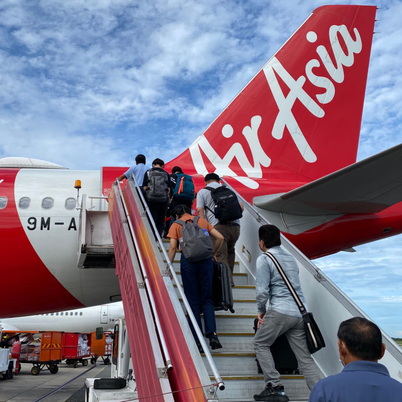 Tourists-Board-AirAsia-Plane