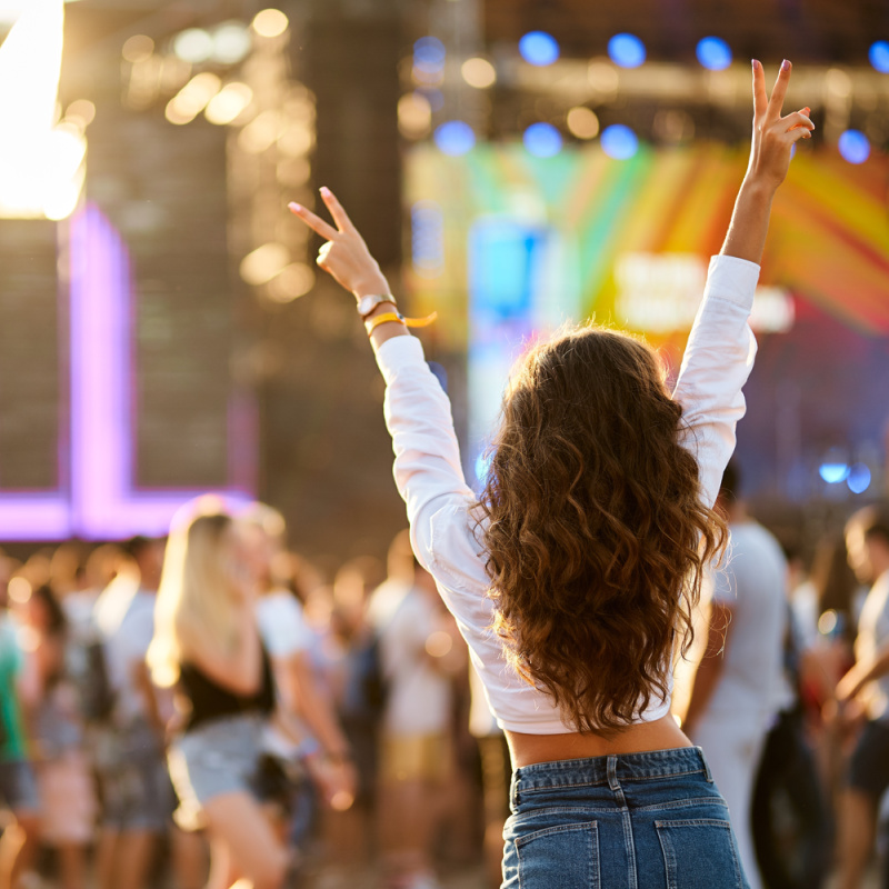 Woman-Looking-At-Stage-At-Music-Festival