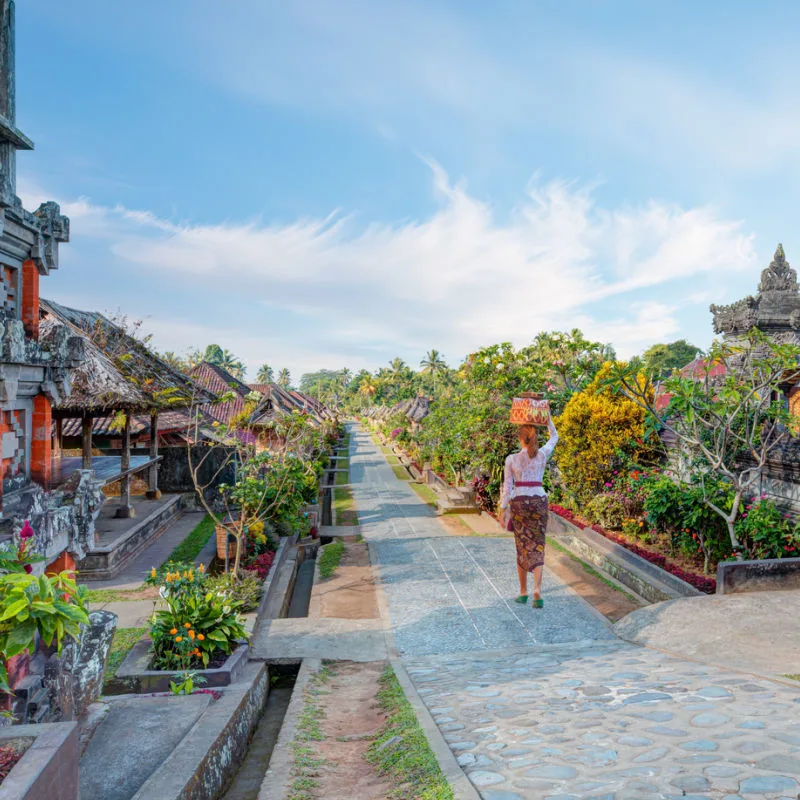 Woman-Walks-Through-Penglipuran-Villagev