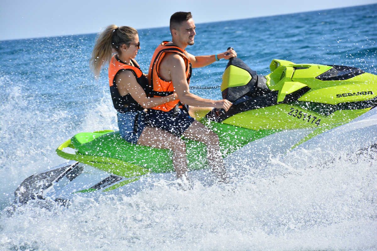 Couple on a jetski on ocean.jpg