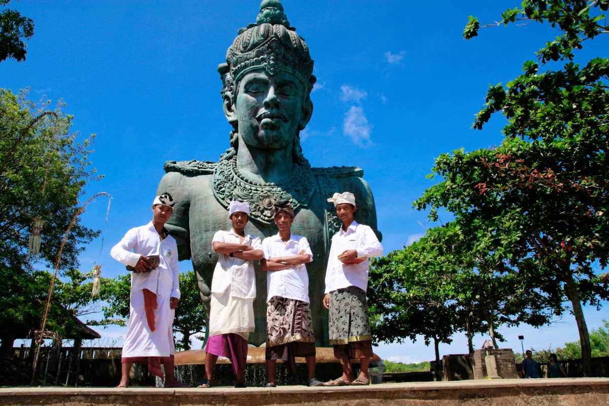 Staff Stand Infront of GWK Vishnu Statue.jpg