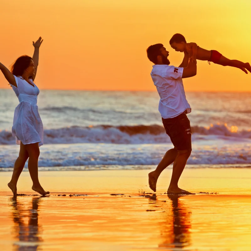 Family-on-beach-at-sunset