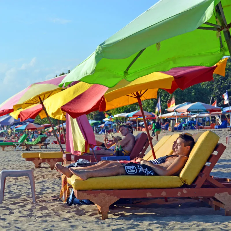 Tourists-Sunbath-on-Legian-Beach-in-Bali