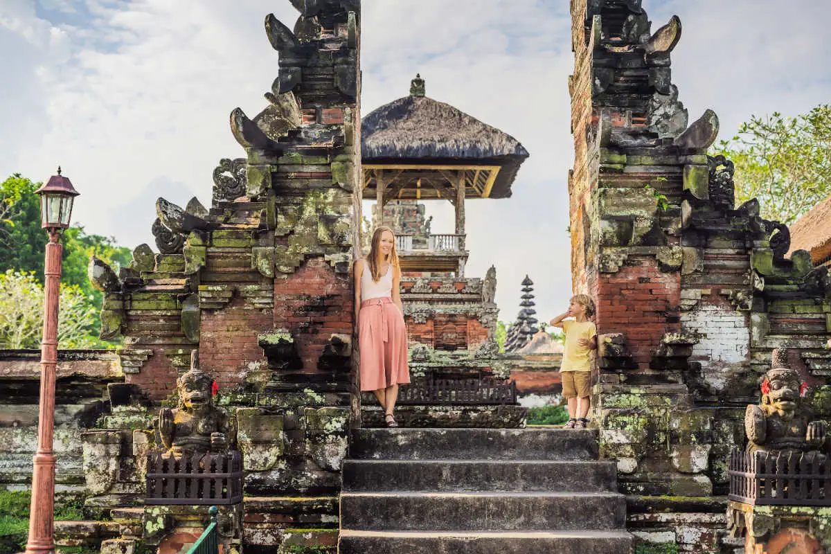 Woman and Son Stand In Temple Gateway in Bali.jpg