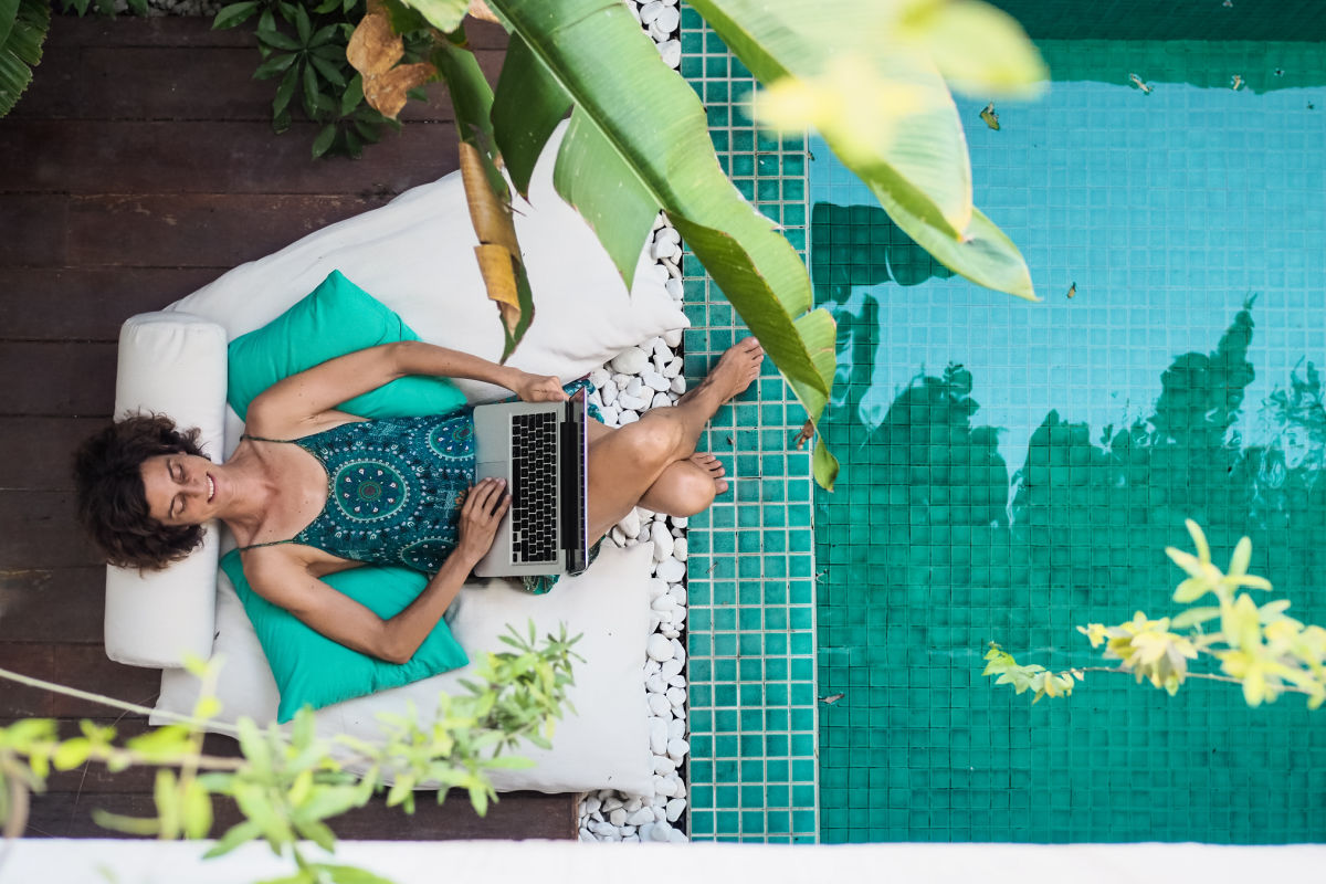 Woman Sits At Pool in Bali Villa On Laptop Digital Nomad.jpg