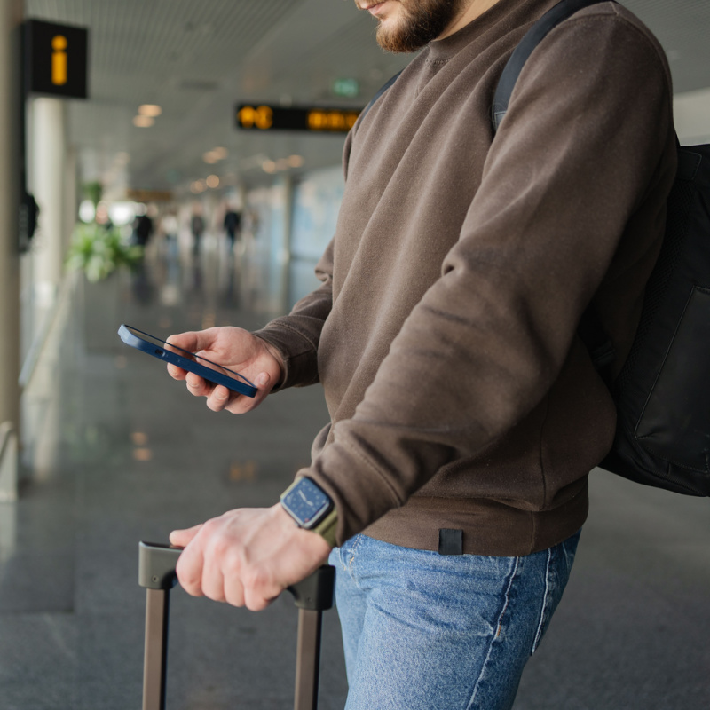 Man-on-Phone-at-Airport