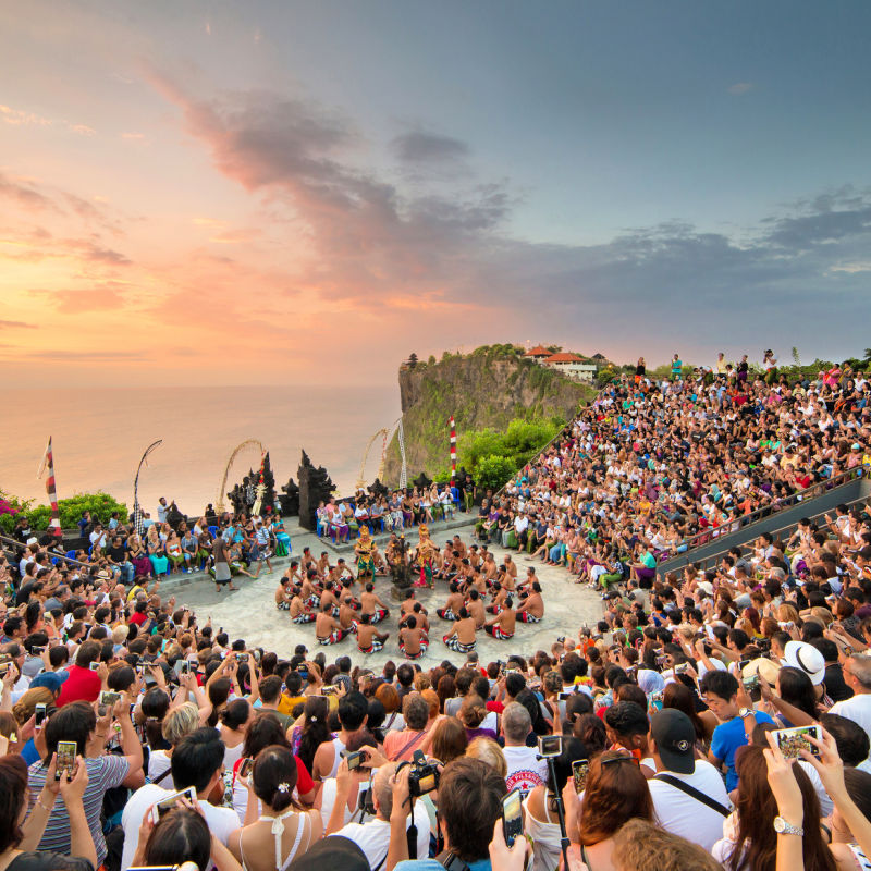 Tourits-Watch-Kecak-At-Uluwatu-Temple-in-Bali-at-Sunset