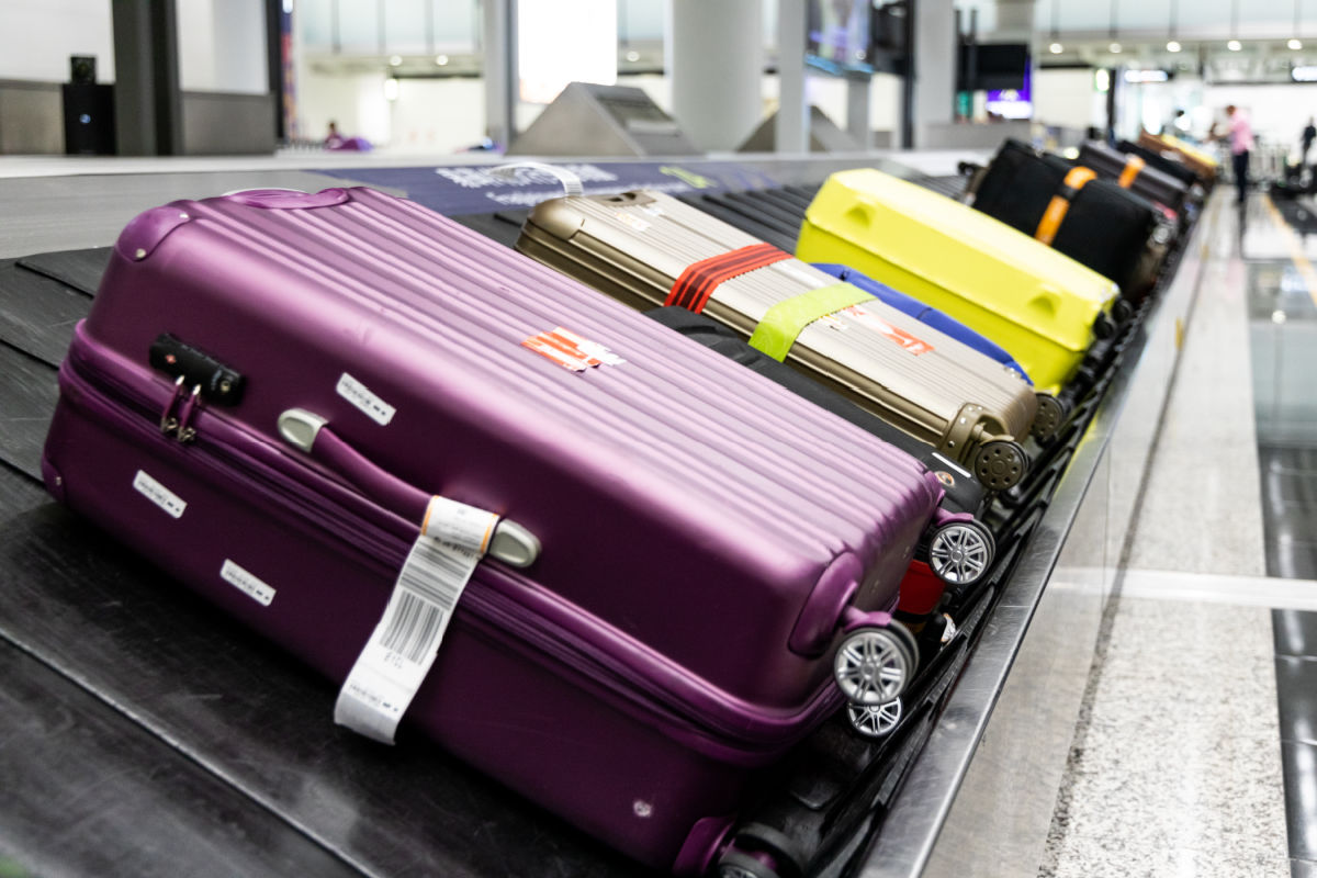 Luggage On Carousel At Airport.jpg