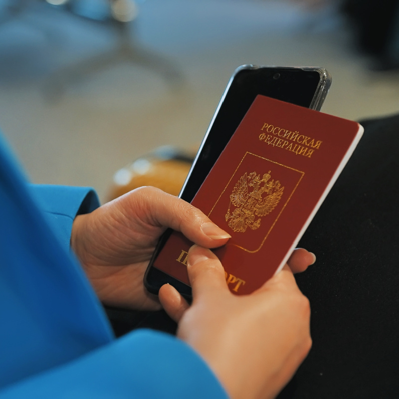 Womans-hand-holds-Russian-Passport