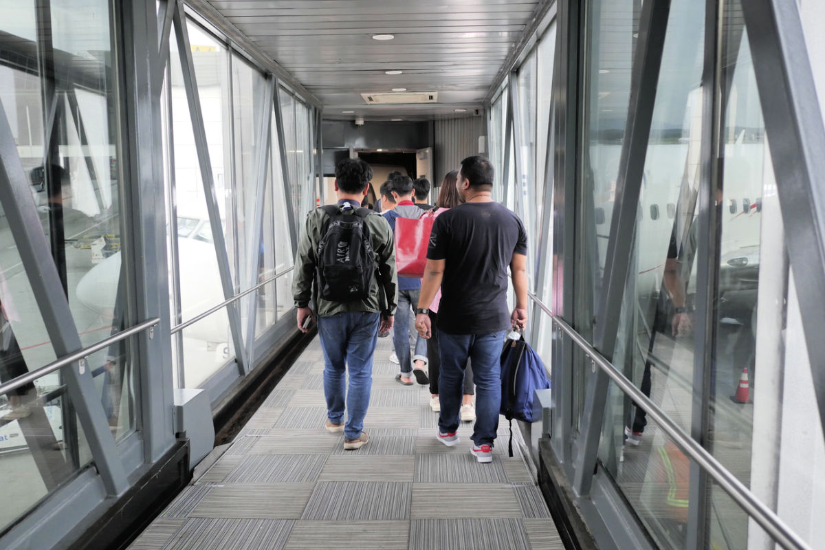 Tourists Board Plane Down Tunnel.jpg