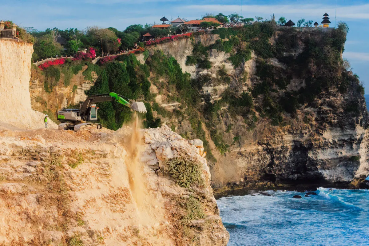 Digger and Heavy Machinery Work On Uluwatu Cliff in Bali.jpg