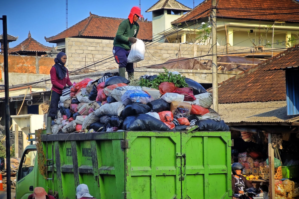 Trash Collectors on Waste Garbage Truck in Bali.jpg