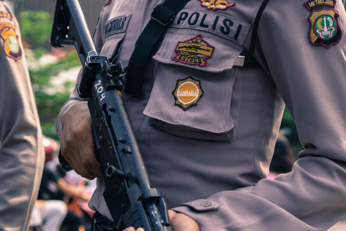 Security Officer in Indonesia Holds Firearm