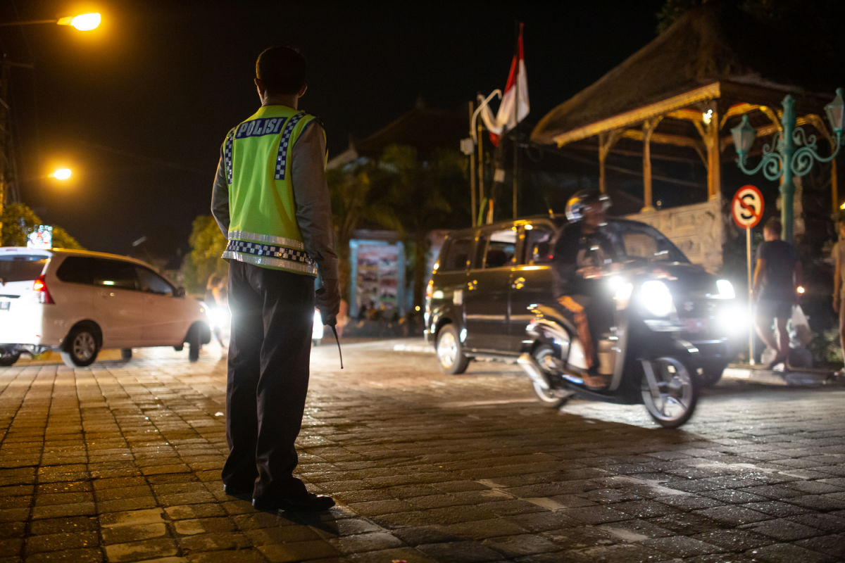 Traffic Police At Intersection at Night Bali