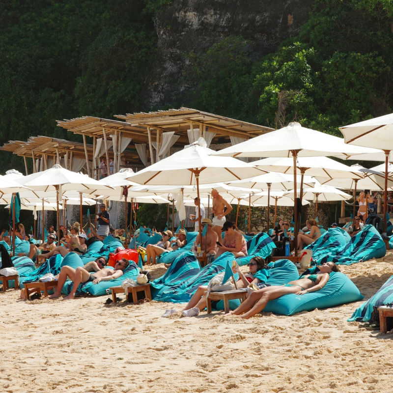 Tourists-Sunbathe-on-Beanbags-on-Sundays-Beach-Club-in-Uluwatu-Bali