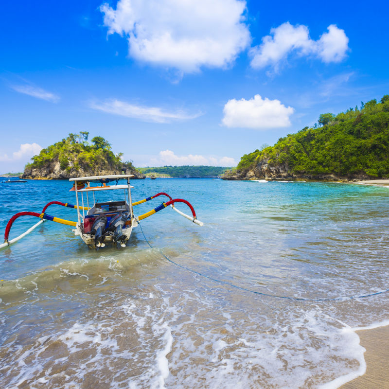 Nusa Penida Beach With Junkung Boat On Water