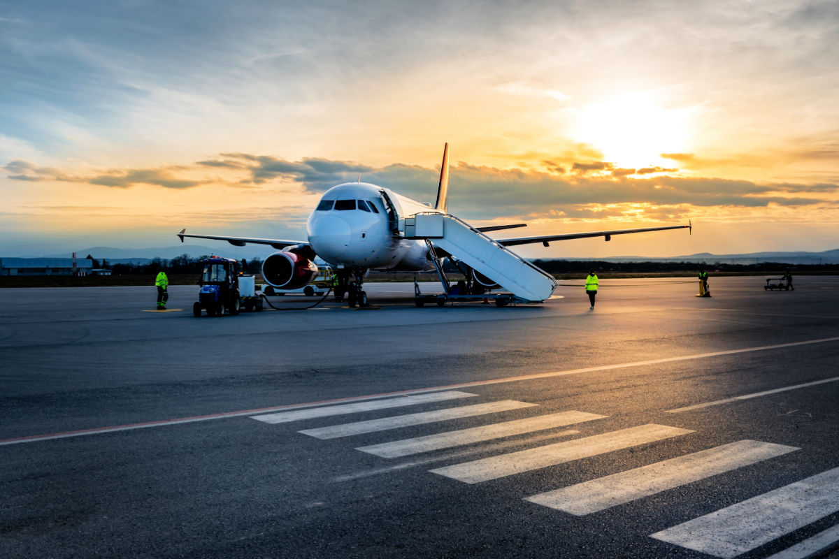 Plane on Runway At Sunset.jpg